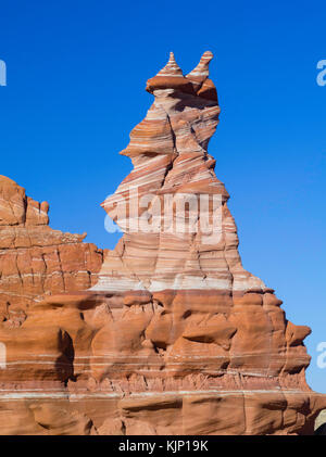 Morning view of the Hopi Clown, a Moenave Sandstone formation in the Adeii Echii Cliffs of Coconino County, Arizona. Stock Photo