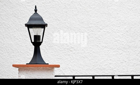 Outdoor lamp on a wall near a villa in Spain Stock Photo