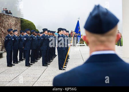 171111-N-EJ549-0003 Liège, Belgium (Nov,11 2017) Airmen from the 786th Civil Engineer Squadron stand at parade rest during the Armistice Day ceremony, Nov. 11, 2017, Henri-Chapelle American Cemetery, Belgium. These Airmen were among a group of service members who came together on Veteran’s Day and Armistice Day to honor nearly 8,000 fallen Americans interred here after World War II. (U.S. Navy photo by Information Systems Technician Seaman Daniel Gallegos/Released) Stock Photo