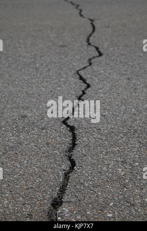 texture of tarmac road with cracks - abstract background Stock Photo