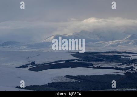 View of Cairngorm mountains in the snow just after sunrise from Ben rinnes in glen rinnes, scotland. Stock Photo