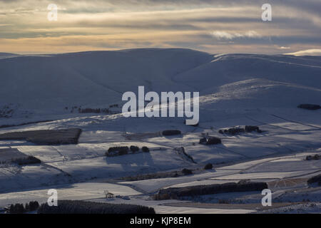 View of Cairngorm mountains in the snow just after sunrise from Ben rinnes in glen rinnes, scotland. Stock Photo