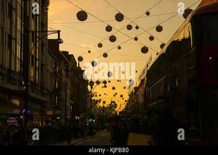 Oxford Street. London, UK. 24th Nov, 2017. Sunsetting over Oxford Street on Black Friday as tens of thousands of people take advantage of Black Friday deals. Black Friday is a sales offer originating from the US where retailers slash prices on the day after the Thanksgiving holiday. Credit: Dinendra Haria/Alamy Live News Stock Photo