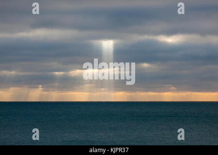 Hastings, East Sussex, UK. 29th November, 2017. Beautiful display of sunlight piercing through the clouds far out to sea. Photo Credit: Paul Lawrenson /Alamy Live News Stock Photo
