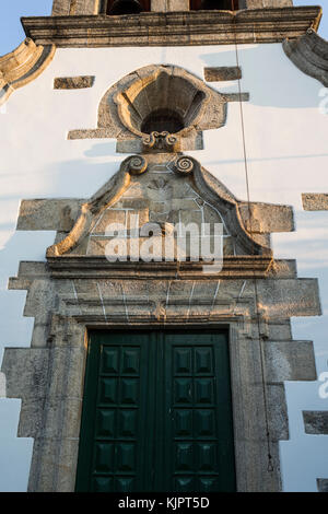 Detail of the rosacea and nich above the portal of the Parish Church of  Bacal, Braganca, Portugal Stock Photo