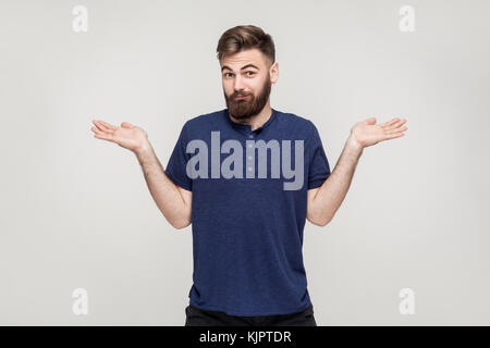 Who knows. It's not me. Puzzled man not sure. Studio shot Stock Photo