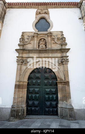 Renaissance portal with Baroque elements such as the nich with the Virgin Mary nursing the Child, in Braganca, Portugal Stock Photo