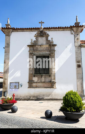 Window on the west side of the Old Cathedral of Braganca, Portugal Stock Photo