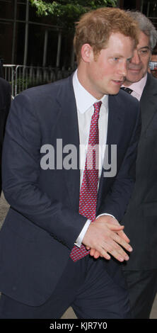 NEW YORK, NY - MAY 14: HRH Prince Harry and British Prime Minister David Cameron arrive on a London Routemaster bus as part of a UK business campaign called 'GREAT' at the Milk Studios on May 14, 2013 in Manhattan, New York. HRH will be undertaking engagements on behalf of charities with which the Prince is closely associated on behalf also of HM Government, with a central theme of supporting injured service personnel from the UK and US forces on May 14, 2013 in New York City.  People:  HRH Prince Harry of Wales Stock Photo