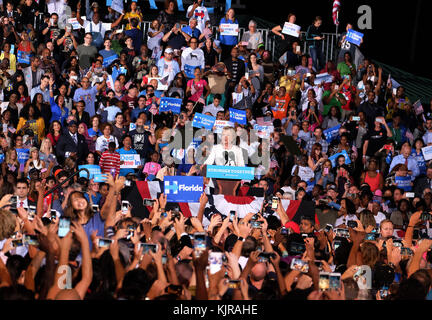 FT LAUDERDALE, FL - NOVEMBER 01: Supporters look on as Democratic presidential nominee Hillary Clinton speaks during a campaign rally at Rev Samuel Deleove Memorial Park on November 1, 2016 in Ft Lauderdale, Florida. The presidential general general election is November 8  People:  Hillary Clinton Stock Photo