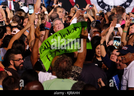 FT LAUDERDALE, FL - NOVEMBER 01: Supporters look on as Democratic presidential nominee Hillary Clinton speaks during a campaign rally at Rev Samuel Deleove Memorial Park on November 1, 2016 in Ft Lauderdale, Florida. The presidential general general election is November 8  People:  Hillary Clinton Stock Photo