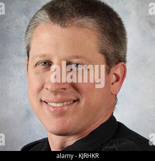 COLORADO SPRINGS, CO - NOVEMBER 27: A police officer (Garrett Swasey, 44) and two civilians died Friday after a man wearing hunting gear and armed with a 'long gun' went on a shooting spree inside a Planned Parenthood clinic. Police detained shooter Robert Lewis Dear at the Planned Parenthood building on November 27, 2015 in Colorado Springs, Colorado.  People:  Garrett Swasey Stock Photo