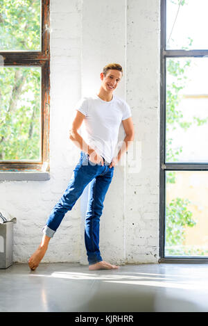 Young handsome male dancer practicing in classical ballet in small studio  with mirrors. Man in white tights. Professional choreographer is working on  Stock Photo - Alamy