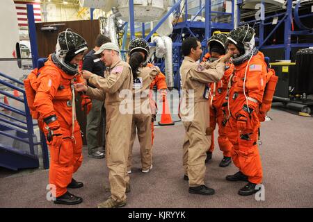 NASA Space Shuttle Atlantis International Space Station STS-135 mission prime crew astronauts (L-R) Chris Ferguson, Doug Hurley, Sandy Magnus and Rex Walheim suit up in launch and entry suits for a training session at the Johnson Space Center Space Vehicle Mock-Up Facility May 24, 2011 in Houston, Texas.   (photo by Robert Markowitz via Planetpix) Stock Photo