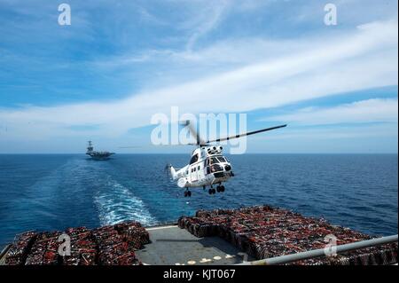 A U.S. Navy SA-330J Puma helicopter lands on the flight deck aboard the U.S. Navy Lewis and Clark-class dry cargo and ammunition ship USNS Amelia Earhart November 19, 2017 in the Pacific Ocean.  (photo by Dominique M. Lasco via Planetpix) Stock Photo