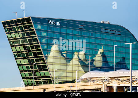 'Tent' fiberglass roof (designed by Fentress Bradburn Architects), Jeppesen Terminal Building, reflected on Westin Denver International Hotel,  Denver Stock Photo