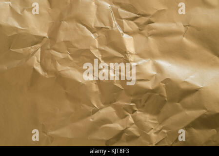 gold color creased paper texture background Stock Photo