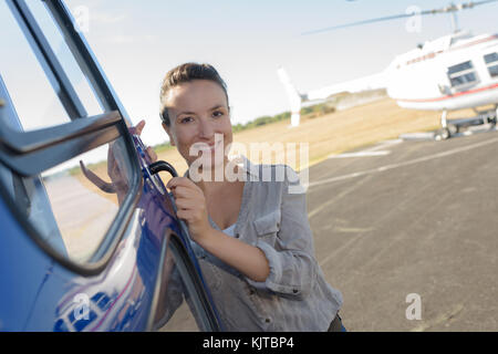 young woman helicopter pilot Stock Photo