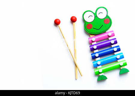 Colourful child's glockenspiel with two wooden mallets, playing Stock Photo