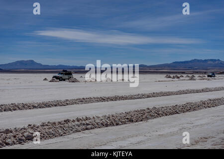 Photo taken in August 2017 in Uyuni Bolivia, South America: Jeep Tour Salt Flats in Salar de Uyuni Desert Bolivia. Salar de Uyuni is largest salt flat Stock Photo