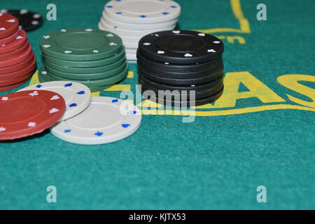 Stack of poker chips on a gambling table Stock Photo