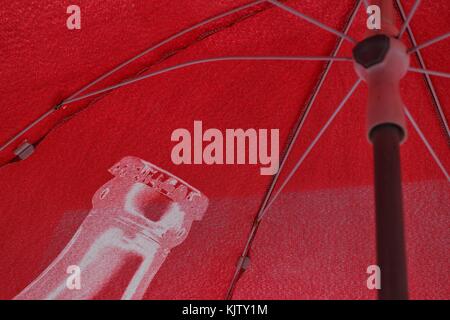Red umbrella under the sun Stock Photo