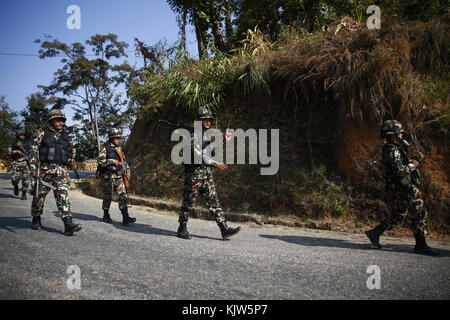 Phidim, Nepal. 26th Nov, 2017. Army soldiers patrol outside a polling station during the first phase of the parliamentary and provincial elections in Phidim Municipality the headquarters of the Panchthar District in the Mechi Zone of eastern Nepal some 600 km from the Capital on Sunday, November 26, 2017. Credit: Skanda Gautam/ZUMA Wire/Alamy Live News Stock Photo