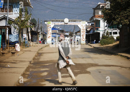 Phidim, Nepal. 26th Nov, 2017. A man crosses an isolated road during the first phase of the parliamentary and provincial elections in Phidim Municipality the headquarters of the Panchthar District in the Mechi Zone of eastern Nepal some 600 km from the Capital on Sunday, November 26, 2017. Credit: Skanda Gautam/ZUMA Wire/Alamy Live News Stock Photo