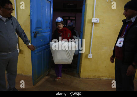 Phidim, Nepal. 26th Nov, 2017. An Election Commission staff carries ballot boxes after the first phase of the parliamentary and provincial elections in Phidim Municipality the headquarters of the Panchthar District in the Mechi Zone of eastern Nepal some 600 km from the Capital on Sunday, November 26, 2017. Credit: Skanda Gautam/ZUMA Wire/Alamy Live News Stock Photo