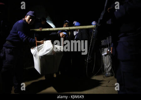 Phidim, Nepal. 26th Nov, 2017. Election Commission staff and Police personnel carry ballot boxes after the first phase of the parliamentary and provincial elections in Phidim Municipality the headquarters of the Panchthar District in the Mechi Zone of eastern Nepal some 600 km from the Capital on Sunday, November 26, 2017. Credit: Skanda Gautam/ZUMA Wire/Alamy Live News Stock Photo