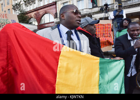 Hyde Park Corner, London, UK. 26th November 2017. Protesters outside the Libyan embassy in London, protesting against black african migrants slave auctions. Stock Photo