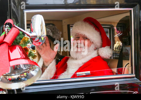 Glasgow, UK. 26th Nov, 2017. 'Glasgow Loves Christmas' annual street carnival is a multicultural, community based celebration of Christmas in the city and was officially launched by EVA BOLANDER, Lord Provost of Glasgow who was accompanied by SANTA CLAUS and he arrived in a city rickshaw peddled by cyclist TOMMY BROWN. The parade made its way from Argyll Street, through the city centre to George Square and was cheered on by thousands of spectators lining the route. Credit: Findlay/Alamy Live News Stock Photo