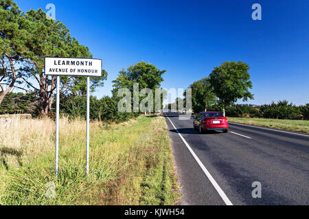 A car traveling along The Avenue of Honour in Learmonth Victoria Australia.Learmonth is an outer suburb of Ballarat.Sunraysia Highway,B220 route. Stock Photo