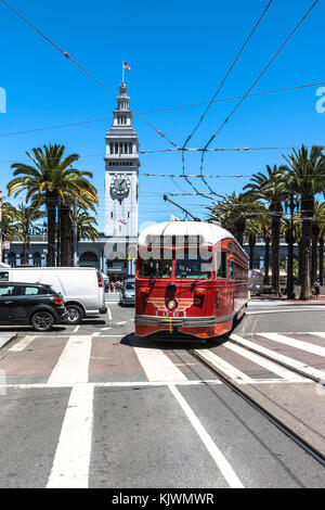 San Francisco,California,USA - June 26, 2017 : The red streetcar in front of the Ferry Building Clock Tower Stock Photo