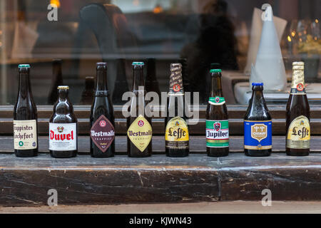 Belgium beer bottles lined up on windowsill outside restaurant in Brussels, Belgium Stock Photo