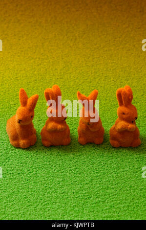 four miniature figurines of Easter bunnies Stock Photo