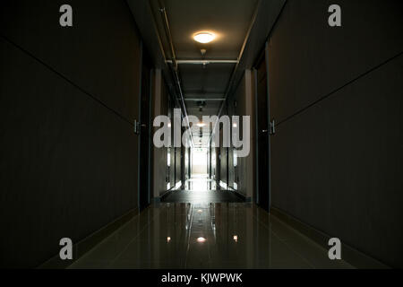 Long corridor in a modern building, light at the end Stock Photo