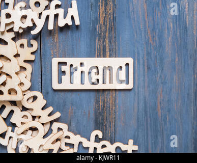 Word made of wooden letters and Pile of wooden block letters on blue wood background Stock Photo