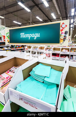 Samara, Russia - September 3, 2017: Sale of office supplies in the hypermarket Karusel. Text in Russian: Writing-books Stock Photo