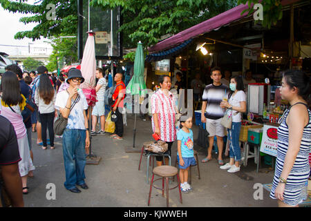 People stop during the 6pm national anthem at Chatuchak weekend