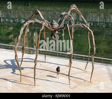 Maman the giant bronze and steel spider sculpture outside the Guggenheim Museum of Art in Bilbao Spain Stock Photo