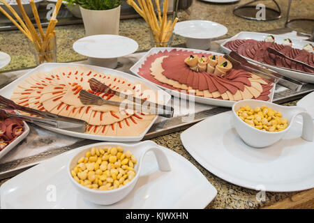 Selection display of cold meat salad food at a luxury restaurant buffet bar area Stock Photo