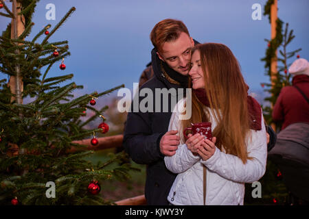 Young happy couple at Christmas market Stock Photo