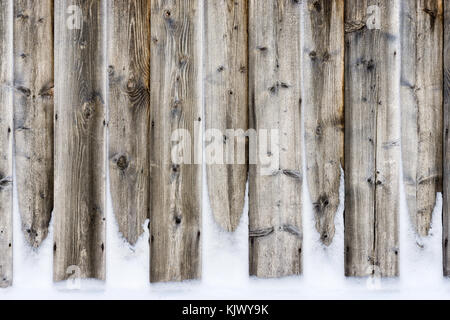 Old vintage wooden wall with snow. Winter and christmas background. Stock Photo