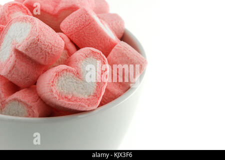 Pink heart shaped marshmallows in the white cup isolated on white back  ground Stock Photo - Alamy