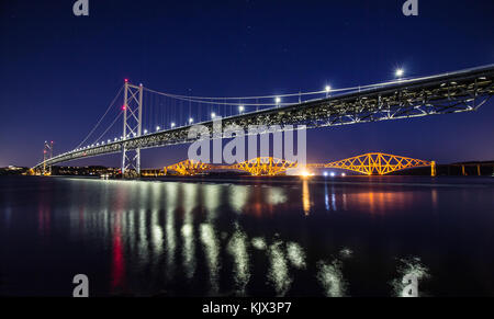 Long Exp of the World famous Forth road Bridge,with the Rail bridge in the background,early evening,taken from Edinburgh.fantastic reflections here. Stock Photo