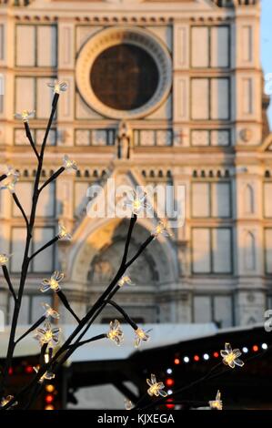 Christmas decorations in Florence with Basilica of the Holy Cross on background. Italy Stock Photo