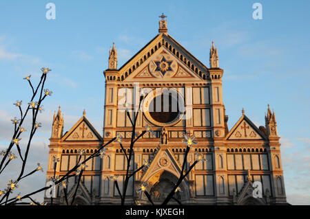 Christmas decorations in Florence with Basilica of the Holy Cross on background. Italy Stock Photo
