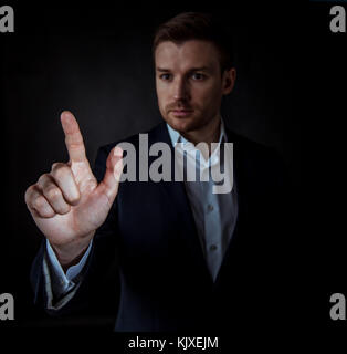 Businessman hand touching virtual screen, modern background concept , copy space for design or text Stock Photo