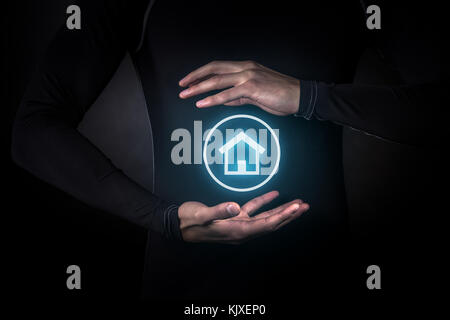 Innovation, future, futuristic object concept, Hands holding glowing smart home icon Stock Photo